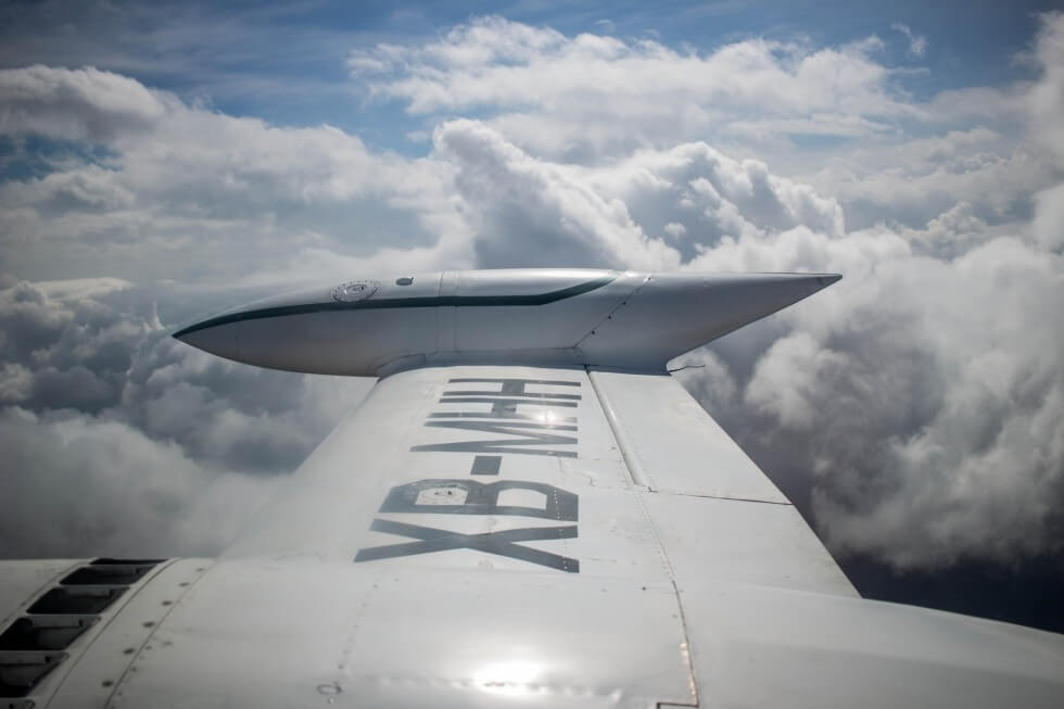 Flying over the clouds in a propeller plane from Puerto Escondido to Oaxaca