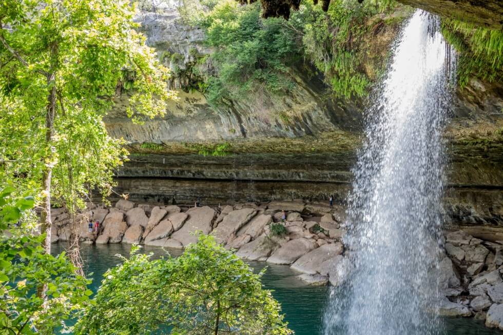 Walking over the rocks Hamilton Pool near Austin Texas