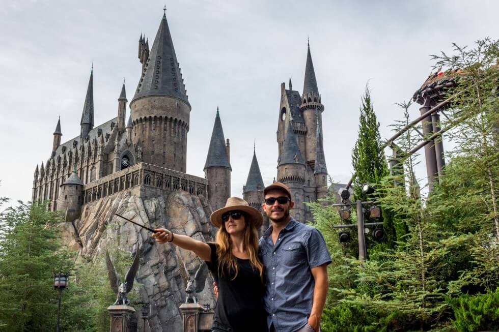 Jenny and Tom in front of Hogwarts Castle Visiting Harry Potter World Orlando