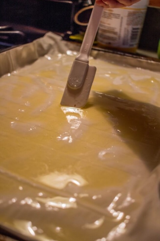 buttering the fillo for baklava