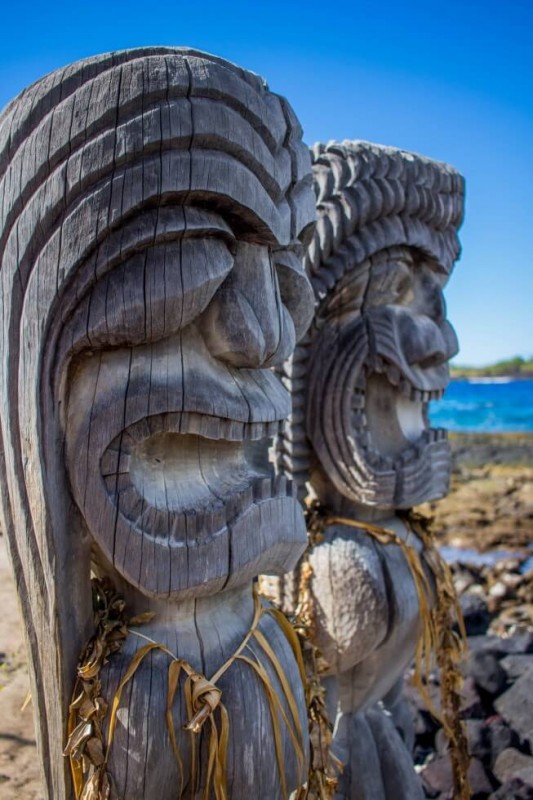 Ki’i (wooden statues) guarding the city of refuge Big Island Hawaii things to do