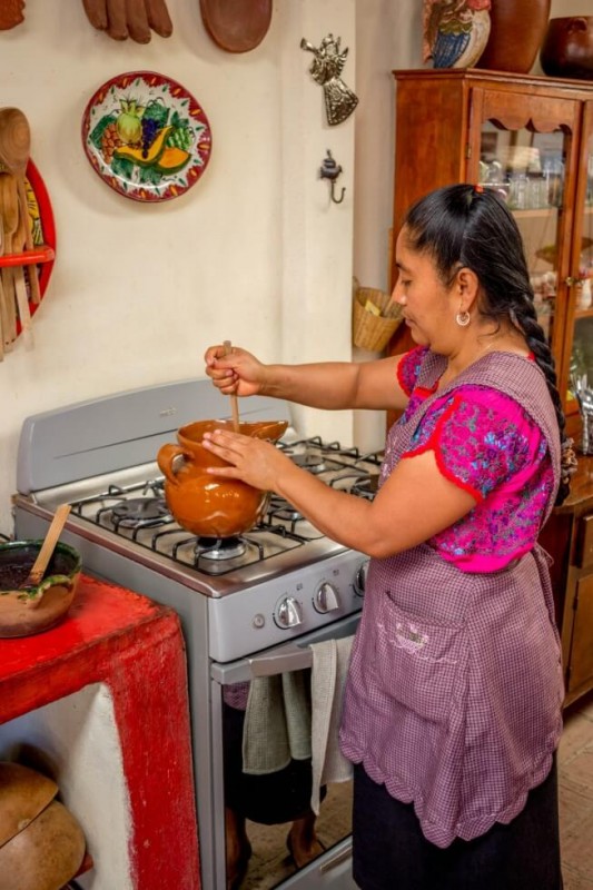 Reyna making Hot Chocolate Oaxaca Cooking Classes