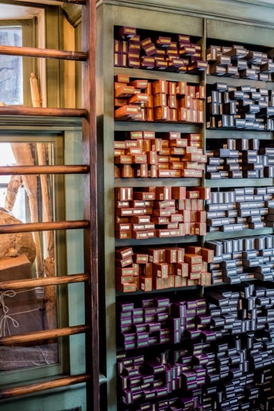 Stacks of wands in Ollivanders in Hogsmeade Visiting Harry Potter World Orlando