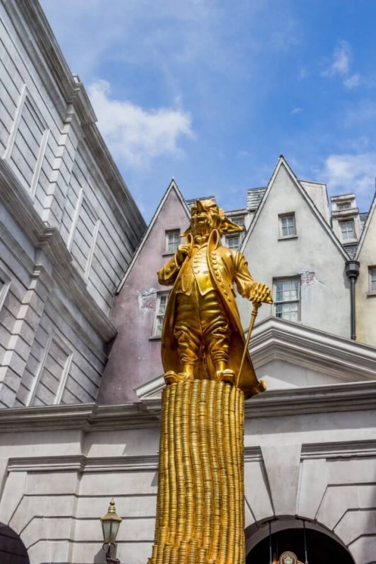 Statue in front of Gringotts Visiting Harry Potter World Orlando